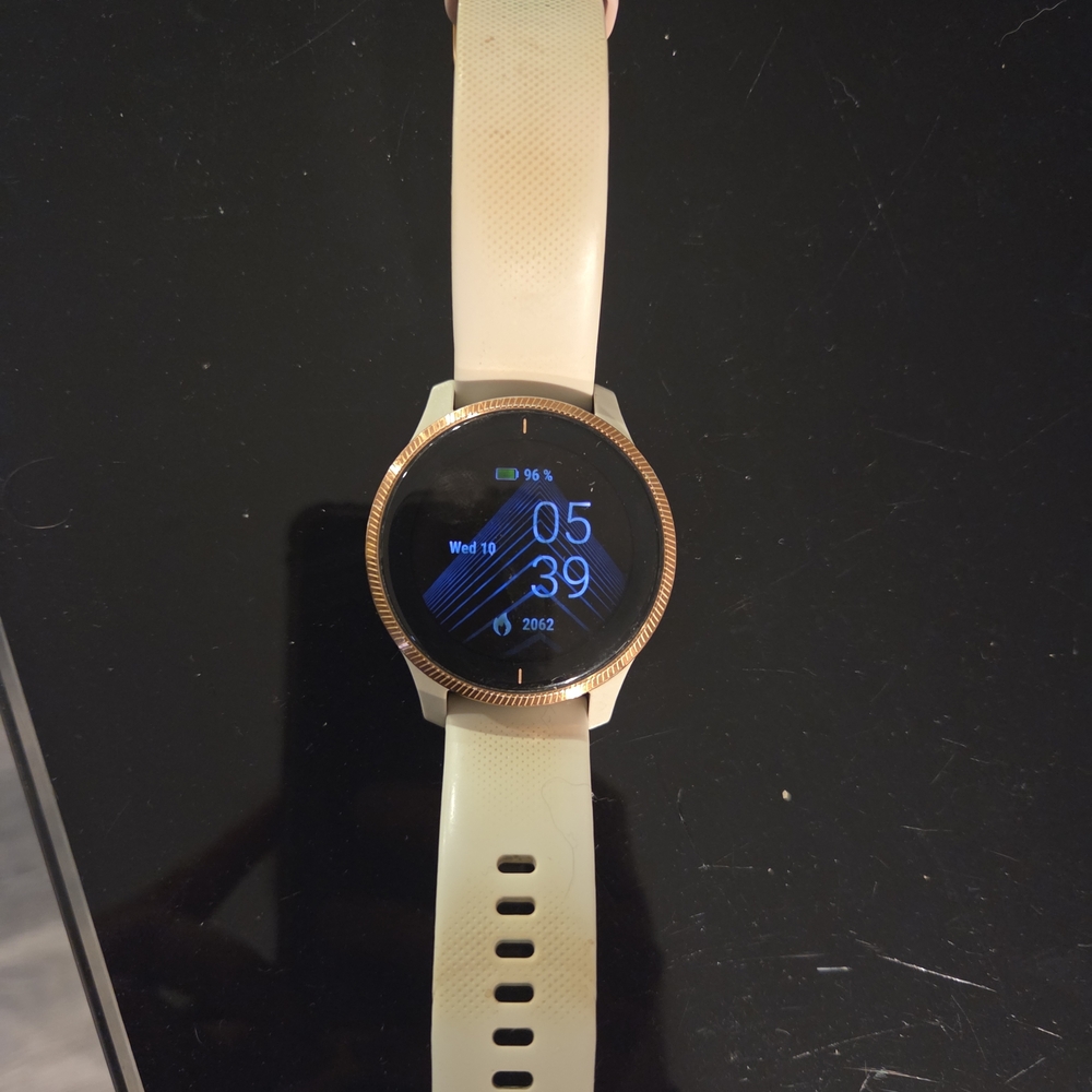 Smartwatch with Gold Bezel and Cream Band